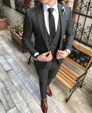 Grey Three Piece Suit Outfits: This look demonstrates it is totally worth investing in such smart menswear items as a grey three piece suit and a white dress shirt. Brown leather tassel loafers are an effective way to infuse a hint of stylish effortlessness into your outfit.