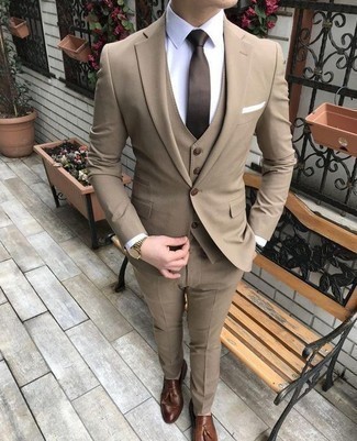 Gold Watch Outfits For Men: To don a casual outfit with a clear fashion twist, you can rely on a tan three piece suit and a gold watch. Complement your look with brown leather tassel loafers to instantly bump up the wow factor of any look.