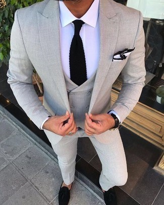 Black Knit Tie Outfits For Men: One of the smartest ways to style such a hard-working menswear item as a grey three piece suit is to wear it with a black knit tie. You could perhaps get a bit experimental with footwear and dress down this outfit by rocking black suede tassel loafers.
