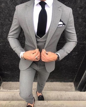 Grey Three Piece Suit Outfits: Go for a polished look in a grey three piece suit and a white dress shirt. Black leather tassel loafers are a simple way to bring a touch of stylish casualness to your look.