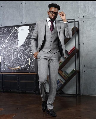 Grey Three Piece Suit Outfits: Pair a grey three piece suit with a white dress shirt for rugged refinement with a modern spin. A pair of black leather tassel loafers will immediately play down an all-too-refined ensemble.