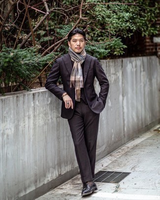 Three Piece Suit Outfits: Go for a sharp look in a three piece suit and a black turtleneck. A pair of black leather tassel loafers makes your getup whole.