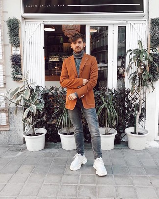 Tobacco Blazer Outfits For Men: The go-to for a kick-ass and sharp getup? A tobacco blazer with grey jeans. White athletic shoes are a simple way to give an air of stylish effortlessness to this getup.