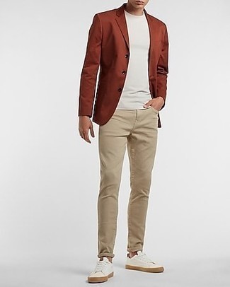 Tobacco Blazer Outfits For Men: Try pairing a tobacco blazer with khaki jeans for casual sophistication with a manly twist. Finishing with white canvas low top sneakers is a surefire way to inject an easy-going feel into this look.