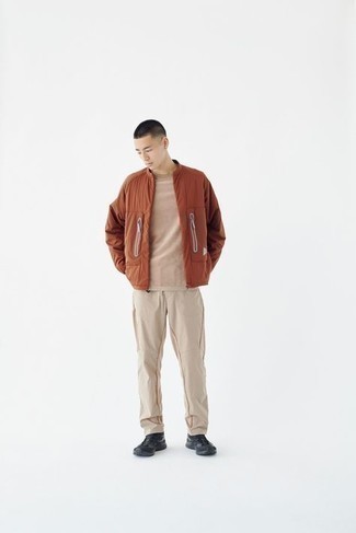 Tan Sweatpants Outfits For Men: This pairing of a tobacco bomber jacket and tan sweatpants is hard proof that a safe casual look doesn't have to be boring. For something more on the daring side to finish off this ensemble, add black athletic shoes to the equation.