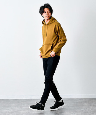 Dark Brown Hoodie Outfits For Men: This combo of a dark brown hoodie and black chinos looks awesome and makes you look instantly cooler. And if you want to effortlessly tone down this look with a pair of shoes, why not introduce a pair of black and white athletic shoes to the mix?