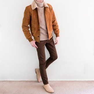 Tan Knit Wool Turtleneck Outfits For Men: Want to infuse your wardrobe with some casual cool? Opt for a tan knit wool turtleneck and brown chinos. Beige suede chelsea boots will effortlessly dress up even the most casual of combinations.