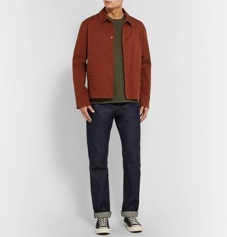 Dark Brown Shirt Jacket Outfits For Men: A dark brown shirt jacket and navy jeans are a wonderful combo that will effortlessly carry you throughout the day. A pair of black and white canvas low top sneakers immediately turns up the wow factor of your look.