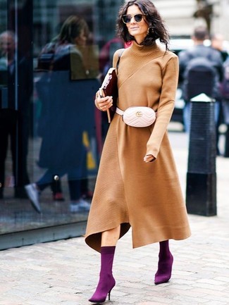 Beige Leather Fanny Pack Outfits: One of our fave ways to style out a tobacco sweater dress is to marry it with a beige leather fanny pack for a casual ensemble. Let your outfit coordination expertise really shine by rounding off your ensemble with a pair of dark purple elastic ankle boots.
