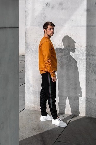 Black Sweatpants Outfits For Men: This off-duty combo of a tobacco sweatshirt and black sweatpants is a surefire option when you need to look good in a flash. We're loving how cohesive this outfit looks when complemented with a pair of white leather low top sneakers.