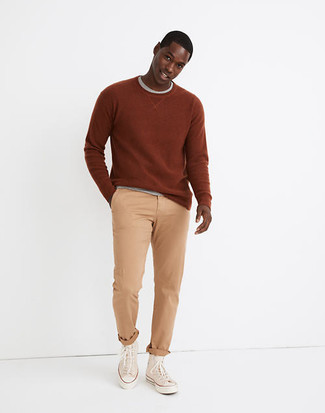 Beige Canvas High Top Sneakers Outfits For Men: Why not consider pairing a tobacco sweatshirt with khaki chinos? Both of these pieces are super functional and will look cool when combined together. Feeling experimental today? Dress down this getup by finishing with a pair of beige canvas high top sneakers.