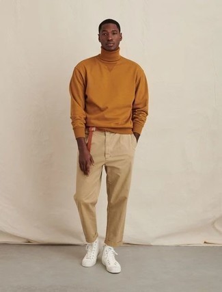 Tobacco Turtleneck Outfits For Men: This casual combo of a tobacco turtleneck and khaki chinos is super easy to pull together without a second thought, helping you look stylish and prepared for anything without spending a ton of time searching through your closet. To bring out a more laid-back side of you, complement your getup with white canvas high top sneakers.