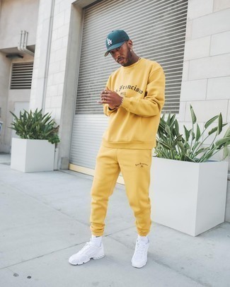 Orange Track Suit Outfits For Men: Reach for an orange track suit to assemble an interesting and casual street style outfit. For something more on the elegant end to finish this ensemble, introduce white athletic shoes to the mix.