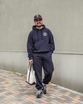 Track Suit Outfits For Men: Consider wearing a track suit to assemble a modern casual and absolutely dapper ensemble. You could perhaps get a bit experimental with footwear and smarten up this ensemble with black and white athletic shoes.