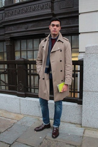 Tan Trenchcoat Outfits For Men: This smart casual combo of a tan trenchcoat and blue jeans is super easy to throw together without a second thought, helping you look seriously stylish and ready for anything without spending too much time digging through your wardrobe. Bump up this getup by rounding off with burgundy leather monks.