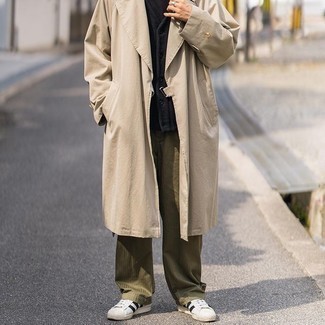 Trenchcoat Outfits For Men: Consider pairing a trenchcoat with olive chinos and you'll exude manly refinement and class. To inject a dose of stylish effortlessness into this look, complement this outfit with white and black canvas low top sneakers.