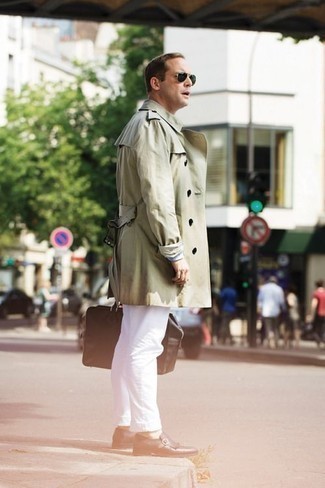 Tan Trenchcoat Outfits For Men: A tan trenchcoat and white chinos are the kind of a tested outfit that you need when you have no extra time to spare. Finishing with a pair of dark brown fringe leather loafers is the most effective way to breathe an extra dose of style into your look.