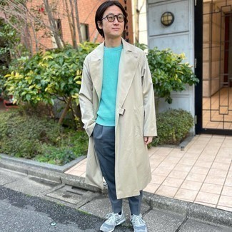 Trenchcoat Outfits For Men: A trenchcoat and blue chinos are among the key elements of a functional wardrobe. Got bored with this look? Enter grey athletic shoes to shake things up.