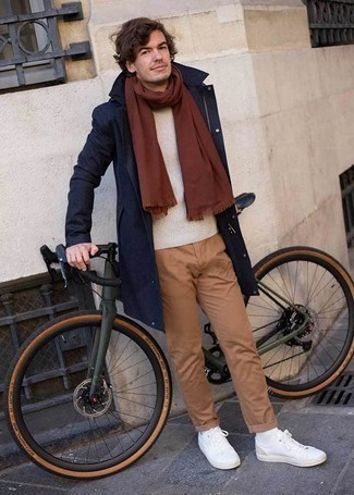Beige Crew-neck Sweater Outfits For Men: Consider wearing a beige crew-neck sweater and khaki chinos for a neat and relaxed and fashionable ensemble. Go off the beaten track and switch up your look by rounding off with a pair of white leather low top sneakers.