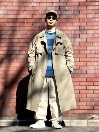 Tan Trenchcoat Outfits For Men: For an ensemble that's worthy of a modern style-savvy man and effortlessly smart, consider wearing a tan trenchcoat and beige chinos. Complete this getup with white canvas low top sneakers to avoid looking too polished.