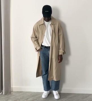 Baseball Cap Outfits For Men: Pair a tan trenchcoat with a baseball cap, if you want to dress for comfort but would also like to look dapper. Let your styling savvy truly shine by completing your ensemble with white leather low top sneakers.