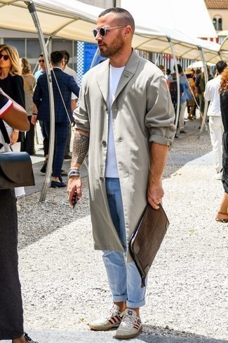 Brown Leather Zip Pouch Outfits For Men: If you're looking for a bold casual yet seriously stylish look, consider teaming a grey trenchcoat with a brown leather zip pouch. Let your sartorial skills truly shine by rounding off your outfit with a pair of white low top sneakers.