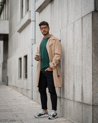 Grey Athletic Shoes Outfits For Men: This combo of a tan trenchcoat and black skinny jeans looks pulled together and makes any gentleman look instantly cooler. Grey athletic shoes will bring a laid-back touch to an otherwise dressy getup.