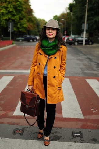 Green Scarf Outfits For Women: When comfort is the priority, try pairing an orange trenchcoat with a green scarf. Brown leather pumps are the simplest way to power up this ensemble.