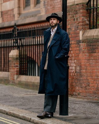Navy Trenchcoat Outfits For Men: Putting together a navy trenchcoat and charcoal dress pants is a surefire way to inject your current styling collection with some rugged elegance. A pair of dark brown leather oxford shoes is a good pick to finish this outfit.