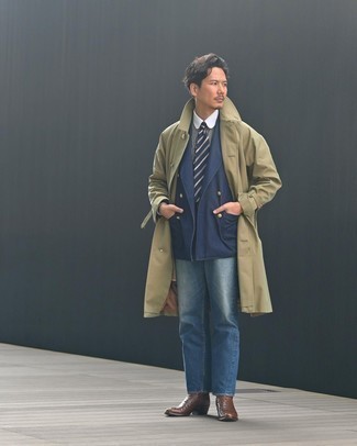 Trenchcoat Outfits For Men: This smart combo of a trenchcoat and blue jeans is extremely easy to put together in no time, helping you look seriously stylish and prepared for anything without spending too much time searching through your closet. Rev up your whole ensemble by slipping into a pair of dark brown leather chelsea boots.