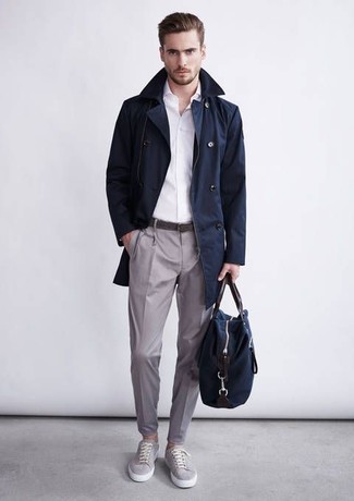 Navy Trenchcoat Outfits For Men: Putting together a navy trenchcoat with grey dress pants is a good pick for a sharp and polished outfit. And if you need to effortlessly dress down this getup with one piece, add a pair of grey plimsolls to this outfit.
