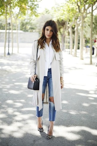 Tan Trenchcoat Outfits For Women: Reach for a tan trenchcoat and blue ripped jeans for a kick-ass and stylish look. Follow a classier route with footwear by rounding off with a pair of white leopard suede pumps.