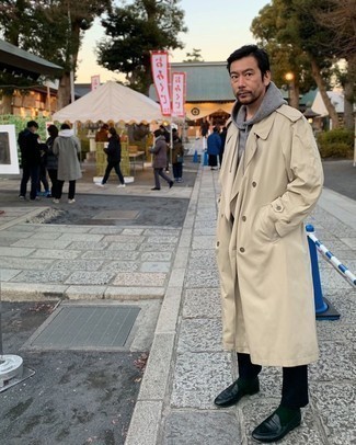 Beige Trenchcoat Outfits For Men: For an ensemble that's extremely easy but can be styled in a variety of different ways, try teaming a beige trenchcoat with black chinos. Get a bit experimental on the shoe front and throw a pair of black leather loafers into the mix.
