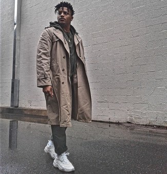 Tan Trenchcoat Outfits For Men: When the dress code calls for a casually neat look, you can easily dress in a tan trenchcoat and charcoal chinos. For something more on the cool and casual side to round off your getup, add white athletic shoes to the mix.