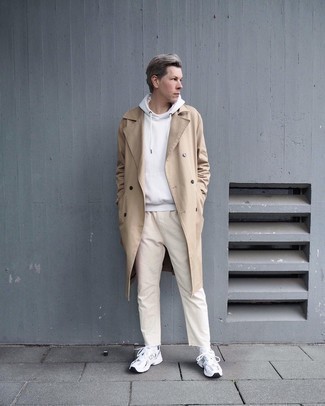 White Hoodie Outfits For Men: You'll be amazed at how easy it is for any guy to throw together this casual look. Just a white hoodie matched with beige jeans. Let your styling savvy really shine by completing this outfit with a pair of silver athletic shoes.