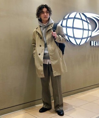 Brown Chinos Chill Weather Outfits: Teaming a beige trenchcoat with brown chinos is an on-point choice for a casually classic getup. Our favorite of a multitude of ways to finish this getup is with a pair of black leather casual boots.