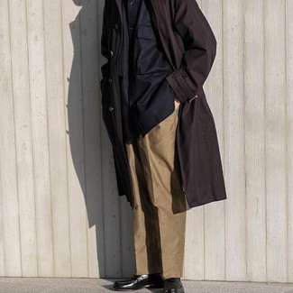 Dark Brown Trenchcoat Outfits For Men: Thumbs up to this combo of a dark brown trenchcoat and khaki chinos! Black leather loafers are the most effective way to transform your ensemble.