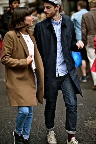 Men's Black Trenchcoat, Light Blue Long Sleeve Shirt, Navy Jeans, White Canvas Low Top Sneakers