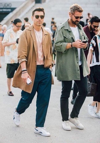 Pink Short Sleeve Shirt Outfits For Men: This combo of a pink short sleeve shirt and teal chinos is proof that a safe casual ensemble can still look really interesting. A pair of white and blue canvas low top sneakers looks perfectly at home teamed with this ensemble.