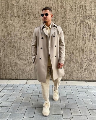 Beige Trenchcoat Outfits For Men: Wear a beige trenchcoat and beige corduroy chinos to feel confident and look sharp. To give this getup a more casual aesthetic, why not introduce beige canvas low top sneakers to the mix?