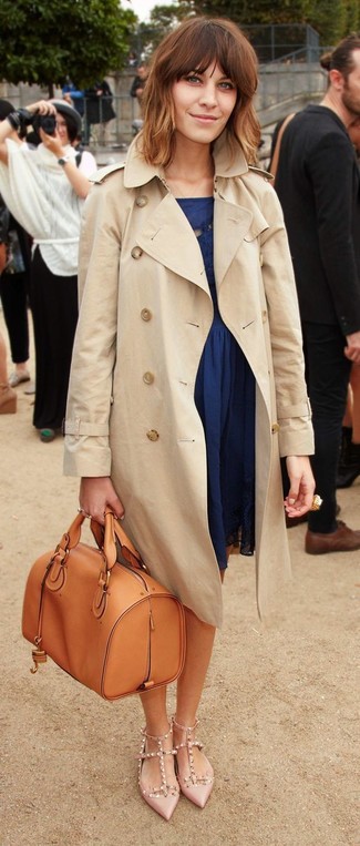 Beige Trenchcoat Outfits For Women: This off-duty pairing of a beige trenchcoat and a navy skater dress is a never-failing option when you need to look cool but have no extra time to spare. Introduce beige studded leather pumps to the equation and ta-da: the ensemble is complete.