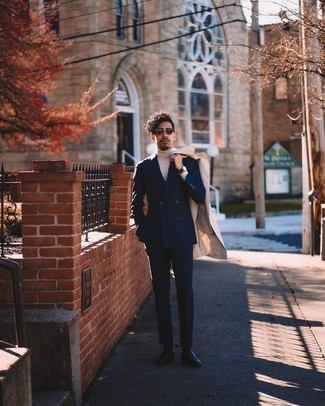 Navy Suit Outfits: This sophisticated pairing of a navy suit and a beige trenchcoat is a popular choice among the dapper gentlemen. Finishing with black leather loafers is an effective way to bring a more laid-back aesthetic to this ensemble.
