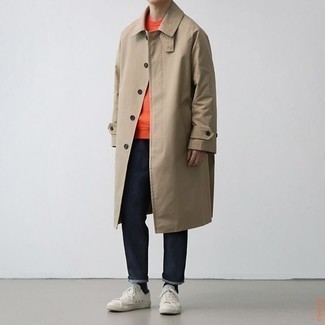 Tan Trenchcoat Outfits For Men: A tan trenchcoat looks so casually smart when paired with navy jeans. To inject a dash of stylish effortlessness into your ensemble, introduce white canvas low top sneakers to this ensemble.