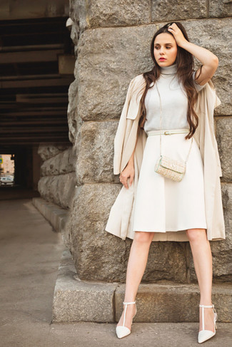 Beige Trenchcoat Outfits For Women: When the situation calls for a refined yet killer getup, you can easily rock a beige trenchcoat and a beige a-line skirt. Look at how nice this getup goes with white leather pumps.