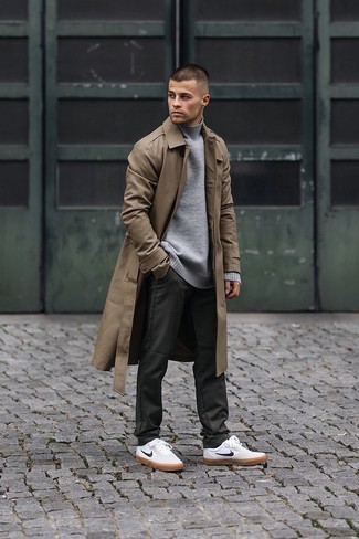 Tan Trenchcoat Outfits For Men: Such essentials as a tan trenchcoat and dark green chinos are the ideal way to introduce some masculine refinement into your daily casual repertoire. Bring a playful touch to this getup by sporting a pair of white and black canvas low top sneakers.