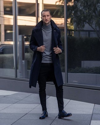 Navy Trenchcoat Outfits For Men: This smart casual combo of a navy trenchcoat and black jeans is super easy to put together in seconds time, helping you look stylish and ready for anything without spending a ton of time combing through your closet. Navy leather derby shoes bring a classy aesthetic to the getup.