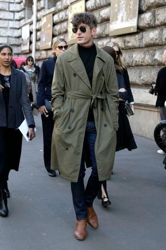 Dark Green Trenchcoat Outfits For Men: This pairing of a dark green trenchcoat and navy jeans is a never-failing option when you need to look effortlessly smart but have zero time. Introduce a pair of brown leather chelsea boots to the mix to take things up a notch.
