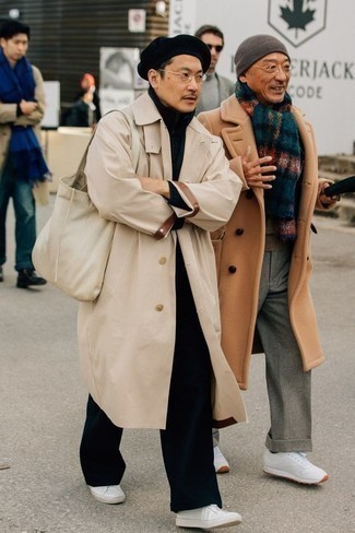 Tan Trenchcoat Outfits For Men: Make a tan trenchcoat and black chinos your outfit choice if you wish to look stylish without too much work. Complement this ensemble with a pair of white leather low top sneakers to add a hint of stylish nonchalance to your ensemble.