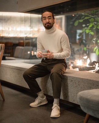 Tan Athletic Shoes Outfits For Men: A white wool turtleneck and brown chinos will introduce extra style into your daily casual repertoire. Rounding off with a pair of tan athletic shoes is a surefire way to infuse a laid-back touch into your outfit.