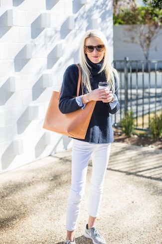 Tan Leather Tote Bag Outfits: This seriously stylish off-duty look is easy to break down: a navy knit turtleneck and a tan leather tote bag. Let your styling skills really shine by finishing your outfit with grey athletic shoes.